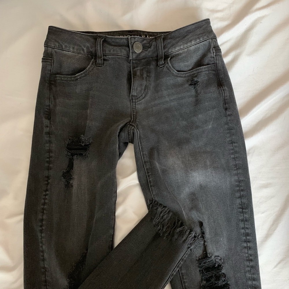 Ripped low rise black jeans
